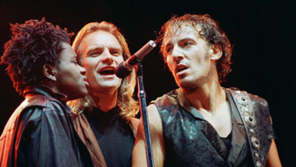 Sting (Mitte) mit Tracy Chapman und Bruce Springsteen bei der Konzerttournee "Human Rights Now!" im Jahr 1988
