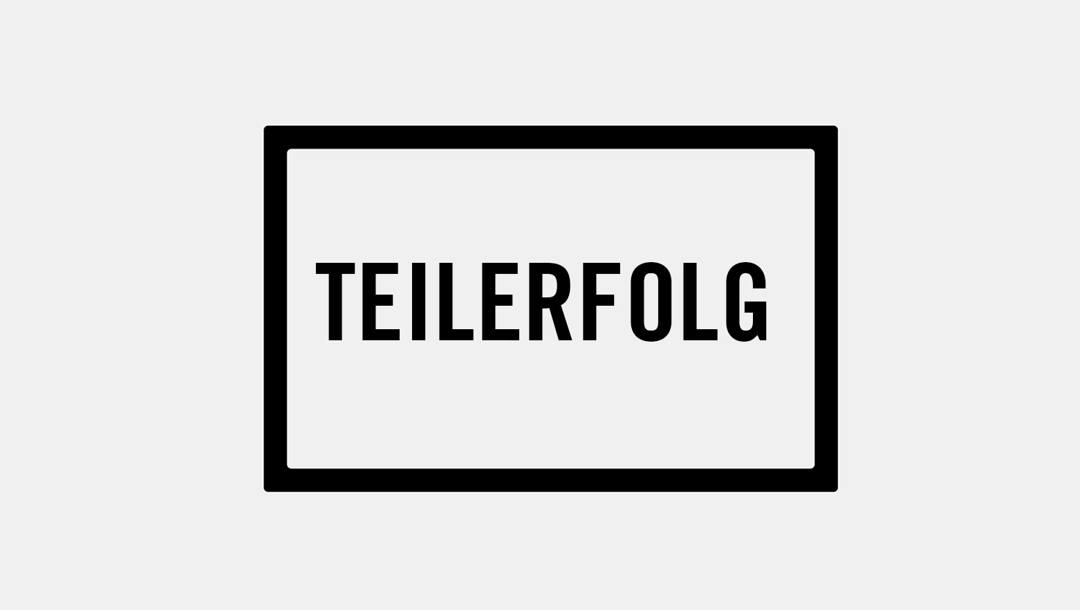 Schriftzug "Teilerfolg" auf grauem Hintergrund mit schwarzem Rahmen