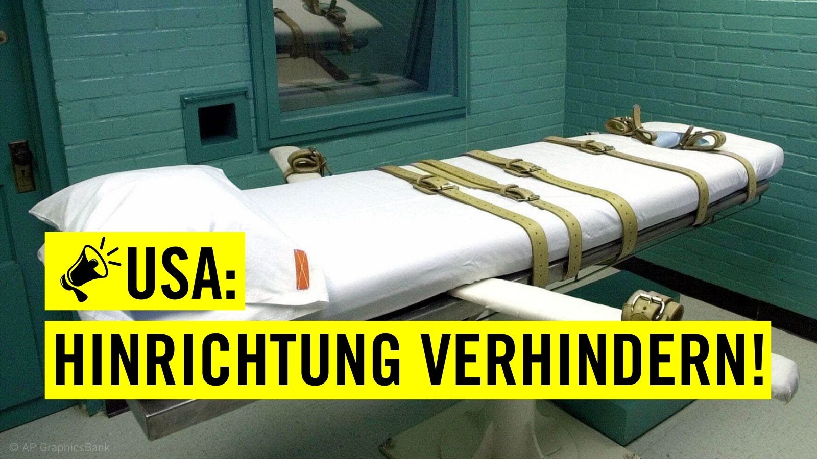 Eine Liege mit vielen Gurten in einem kleinen Raum mit einem Text dazu, der sagt: "USA: Hinrichtung verhindern!"