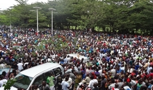 Burundians gather outside the headquarters of RPA  to welcome the release of Bob Rugurika