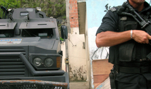 Caveirao/A military police officer stands next to an armoured vehicle, popularly known as the Caveirão, in the Morro Da Fe