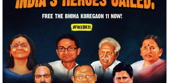 Ein Poster zeigt verschiedene Menschen, darüber der Schriftzug "India's Heroes Jailed"Poster für die Freilassung der Bhima Koregaon 11 mit deren gezeichneten Portraits