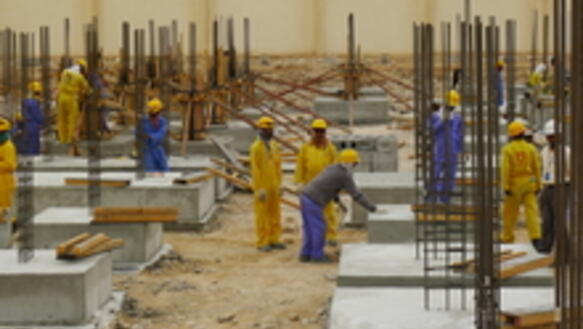 Arbeitsmigranten auf einer Baustelle in Doha im März 2013