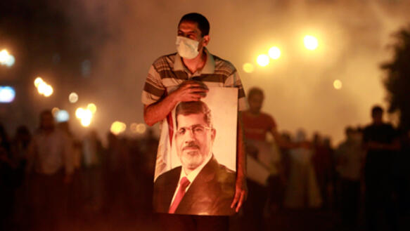 Verletzter Anhänger von Mursi auf der Flucht vor Tränengas, Kairo, 16. Juli 2013